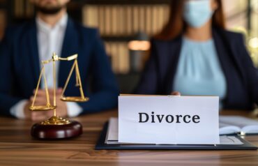 The image features a legal setting with a focus on a sign labeled "Divorce" placed on a desk